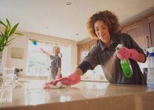 maid cleaning counters