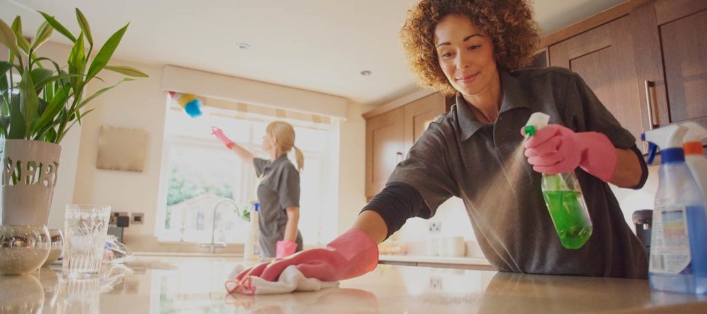 maid cleaning counters